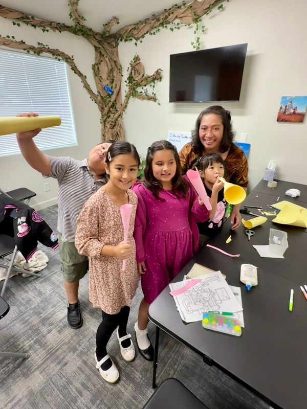 Kids showing off their Sabbath School crafts